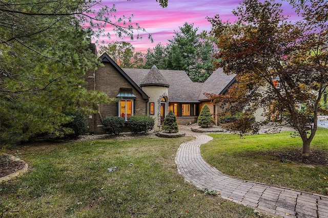 view of front of home with a yard