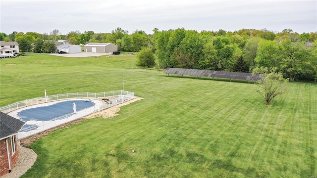 view of yard featuring a covered pool