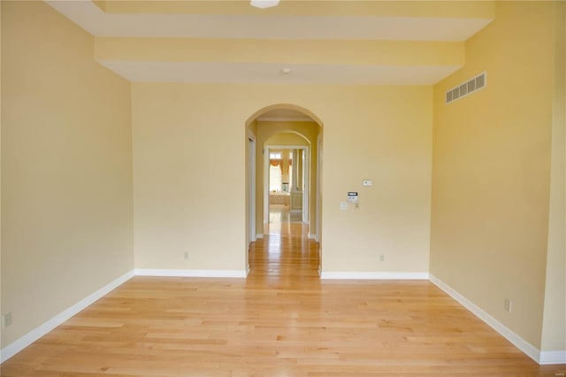 spare room featuring light hardwood / wood-style flooring