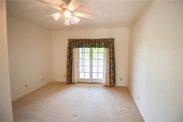 carpeted empty room with ceiling fan