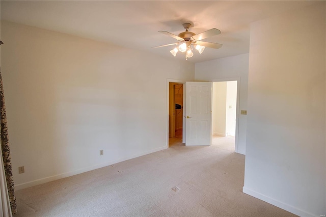 empty room with ceiling fan and carpet floors