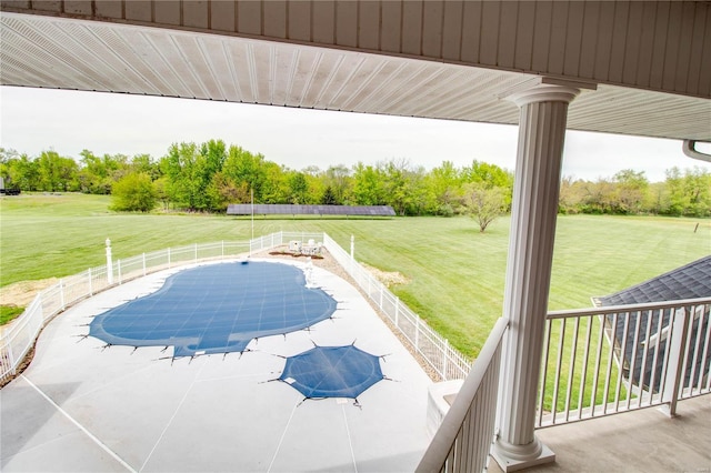 view of swimming pool with a lawn and a patio