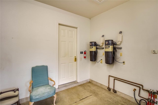 sitting room featuring concrete floors