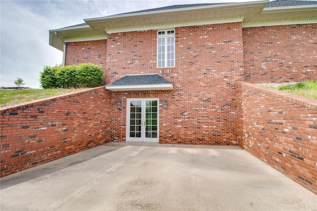 rear view of property featuring a patio and french doors