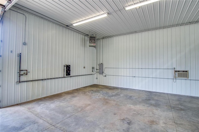 garage with a wall mounted air conditioner