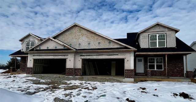 view of front of property with a garage and a porch