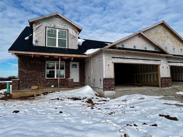 property in mid-construction with a garage and a porch