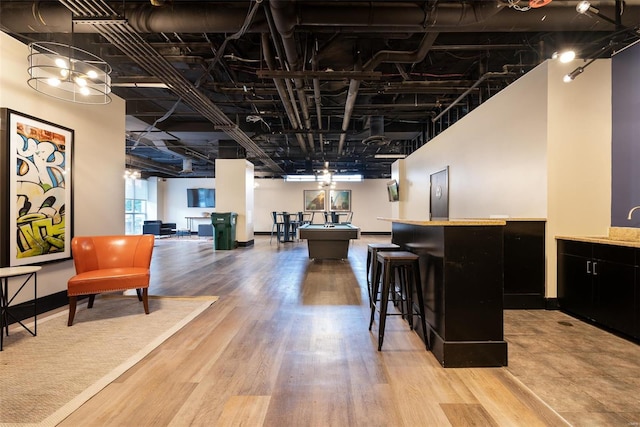 interior space featuring wood-type flooring, sink, and billiards