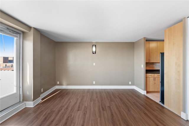 empty room featuring wood-type flooring