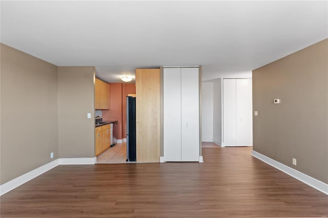 unfurnished living room featuring light hardwood / wood-style flooring