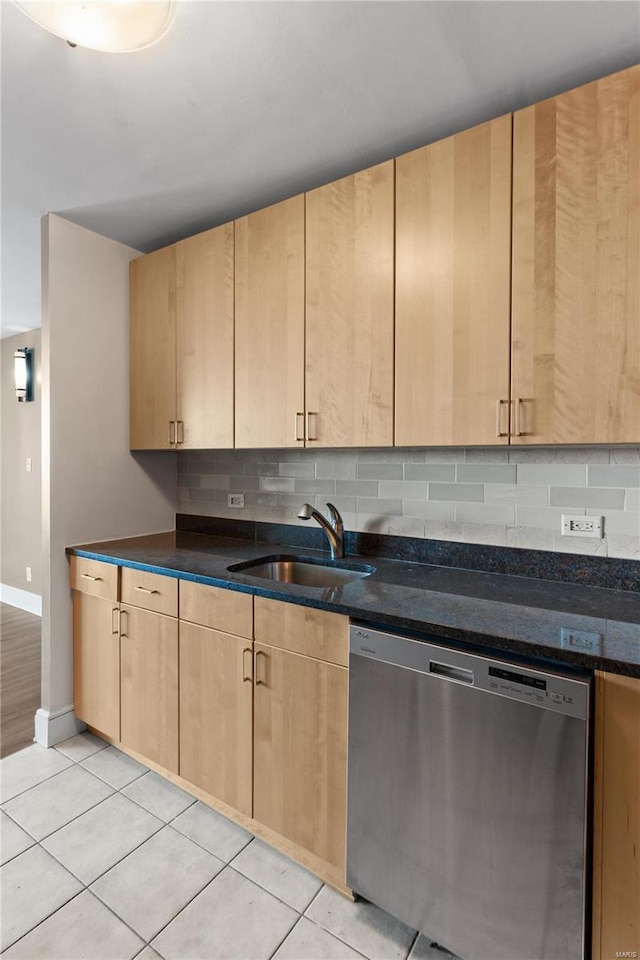 kitchen featuring light tile patterned floors, light brown cabinets, sink, and dishwasher