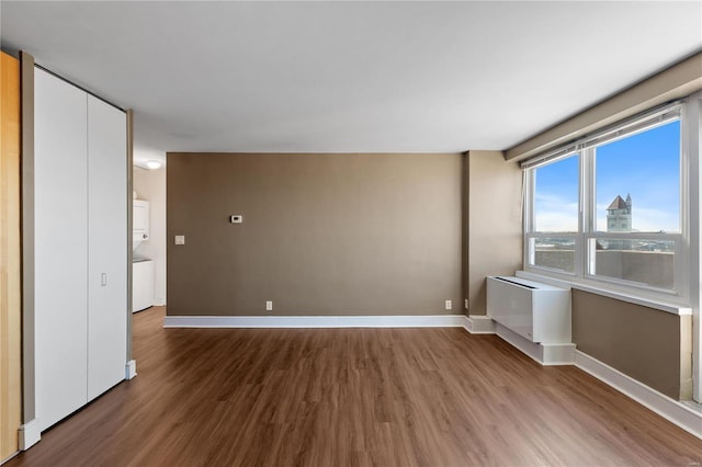 unfurnished room with hardwood / wood-style floors