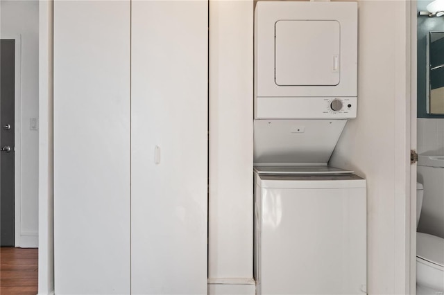 clothes washing area with stacked washer / drying machine