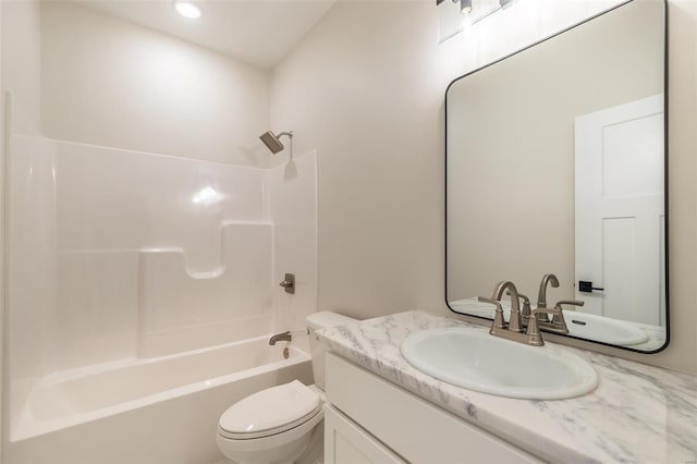 full bathroom featuring  shower combination, vanity, and toilet