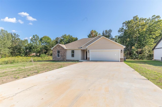 ranch-style home featuring a front yard and a garage