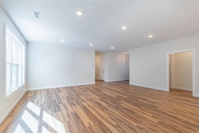 empty room with light hardwood / wood-style floors