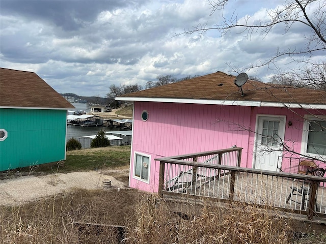 view of property exterior featuring a boat dock