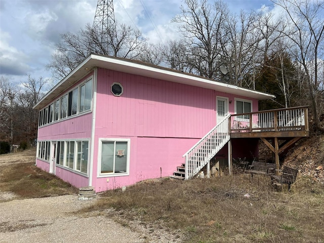 view of side of property with a deck