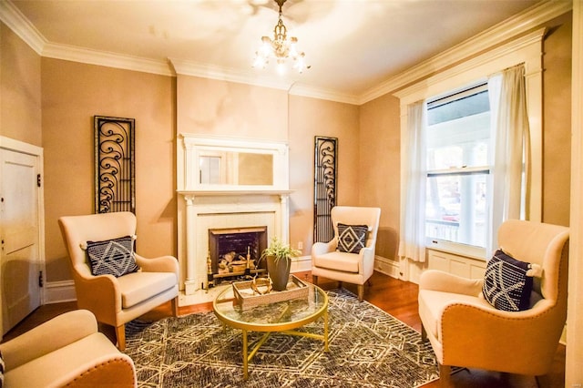 living area featuring a chandelier, crown molding, and wood-type flooring