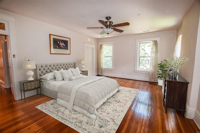 bedroom featuring ceiling fan and dark wood-type flooring