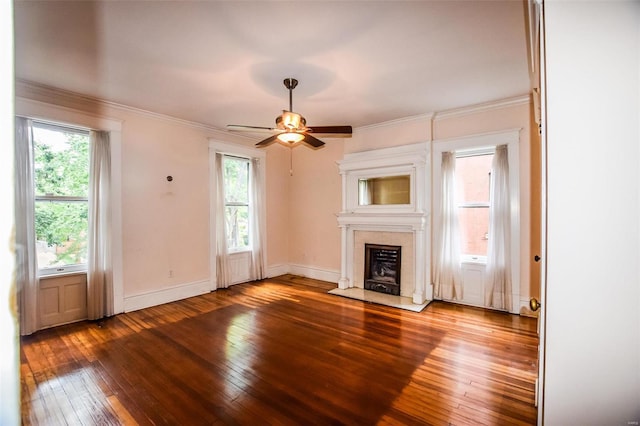 unfurnished living room featuring wood-type flooring, ceiling fan, and ornamental molding