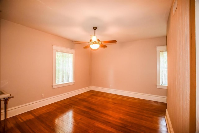 unfurnished room with ceiling fan and hardwood / wood-style floors