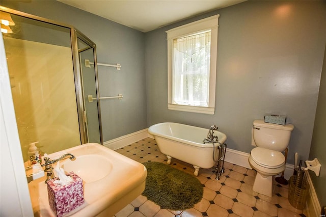 bathroom featuring toilet and shower with separate bathtub