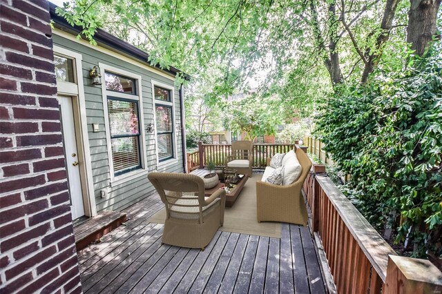 wooden deck featuring an outdoor living space