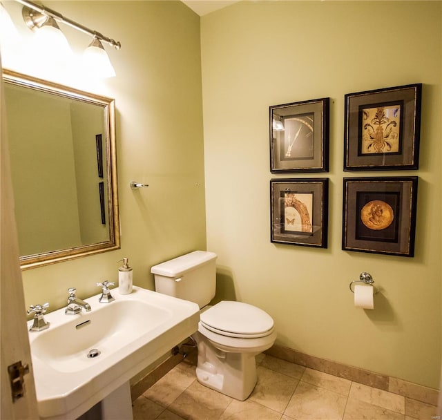 bathroom featuring tile patterned floors, sink, and toilet