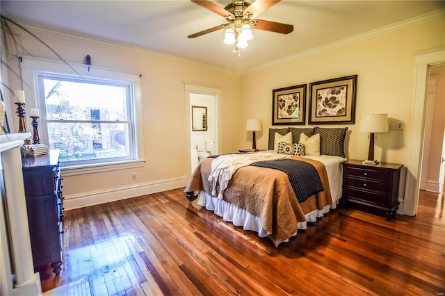 bedroom with ornamental molding, ensuite bath, ceiling fan, and dark wood-type flooring