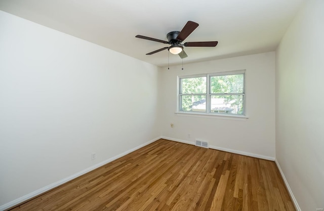 empty room with light hardwood / wood-style floors and ceiling fan