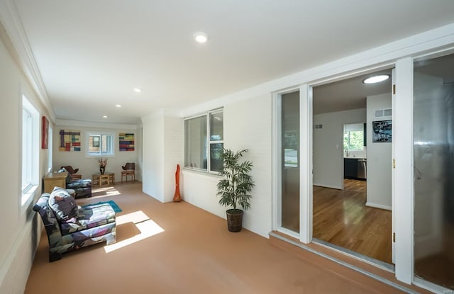 interior space with crown molding