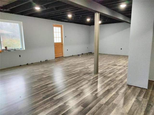 basement with hardwood / wood-style flooring