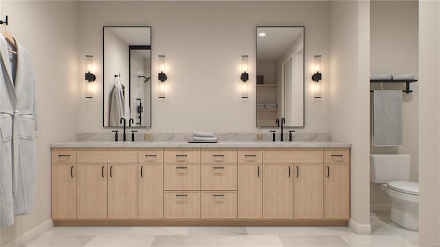 bathroom featuring tile patterned floors, vanity, and toilet