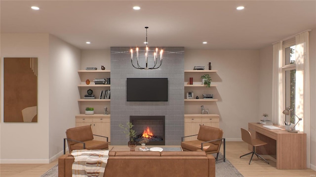 living room with a brick fireplace, a notable chandelier, and light wood-type flooring