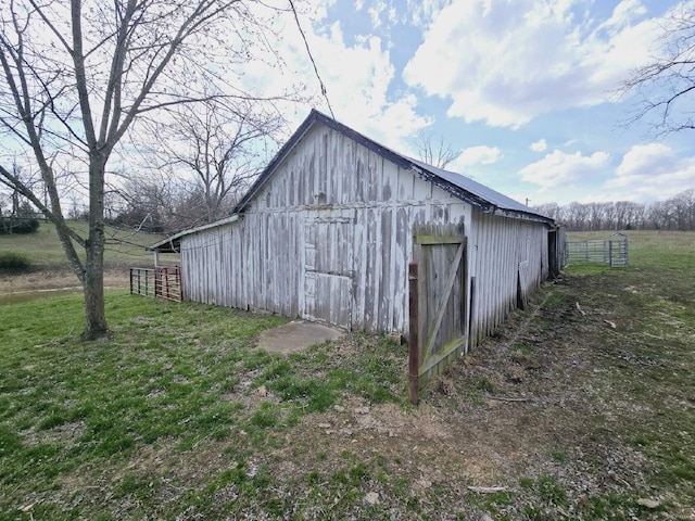 view of shed / structure featuring a yard