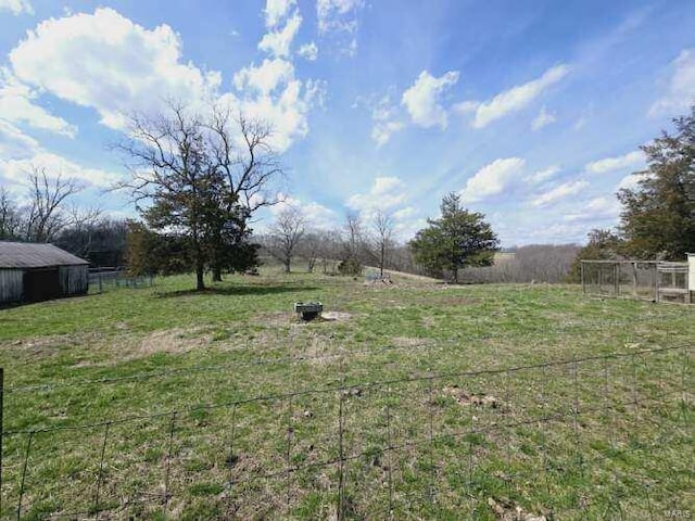 view of yard with a rural view