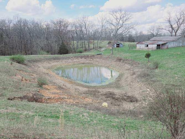 view of pool with a water view