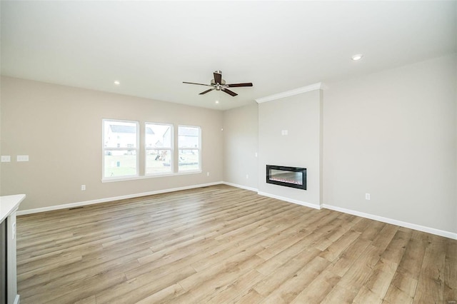 unfurnished living room featuring light wood-type flooring, ceiling fan, and crown molding