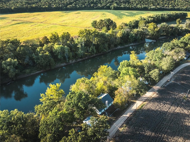 birds eye view of property featuring a water view and a rural view