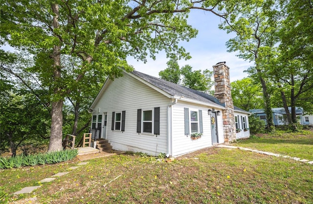 view of side of property with a yard