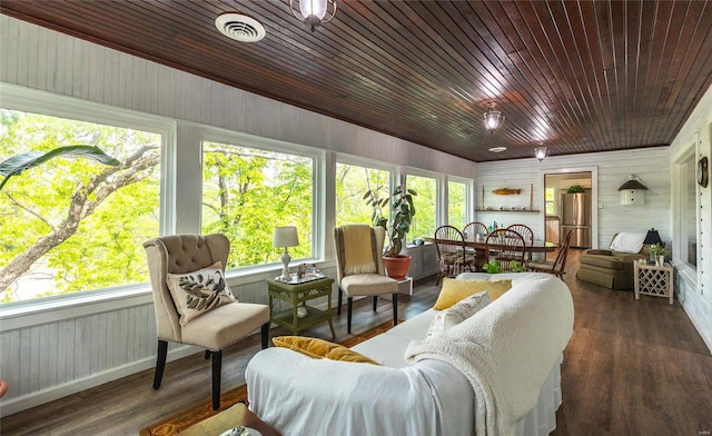 sunroom featuring wooden ceiling and a healthy amount of sunlight