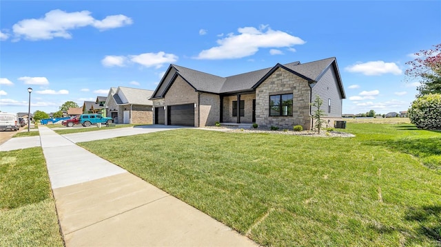 view of front of property featuring a front yard and a garage