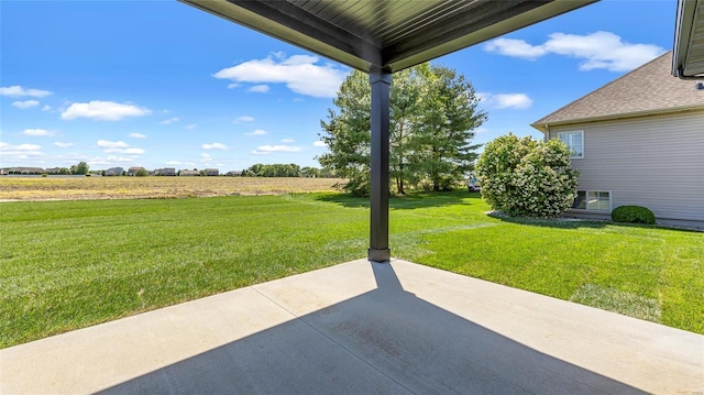 view of yard featuring a patio area and a rural view