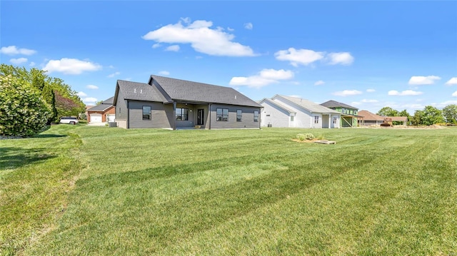 back of house featuring a yard