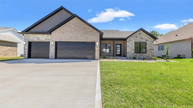 view of front of home featuring a garage and a front yard