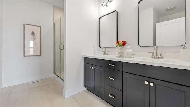 bathroom featuring vanity and an enclosed shower