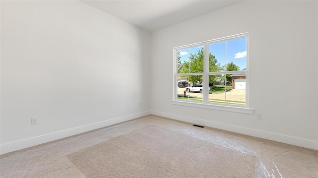 spare room featuring plenty of natural light