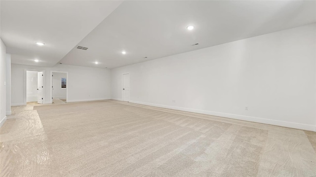 spare room with light colored carpet