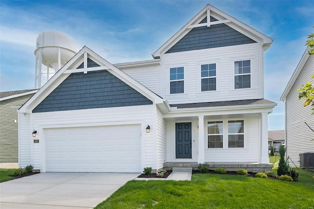 craftsman inspired home featuring central AC unit, a garage, and a front lawn